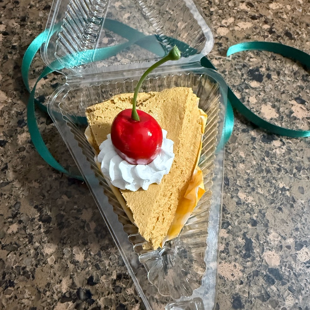 Decorative Cheesecake Slice with Cherry Topper